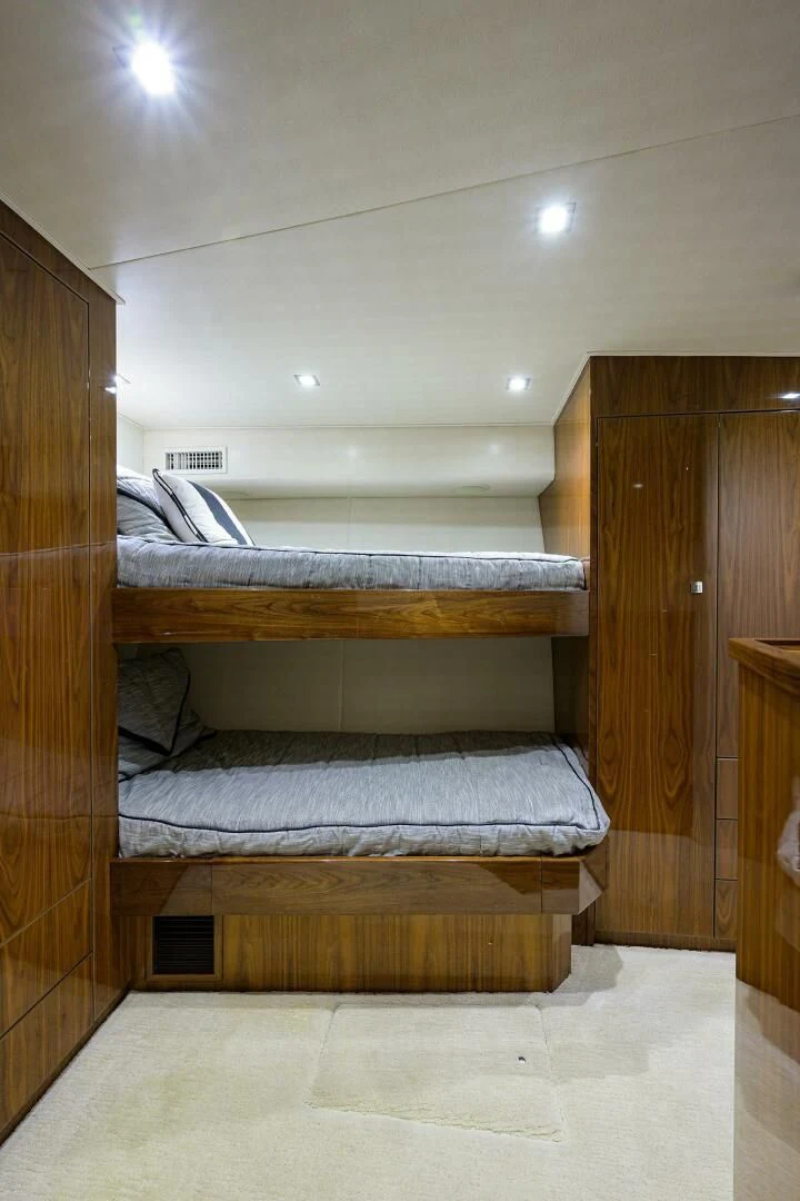 a room with bunk beds aboard 80' VIKING Yacht for Sale