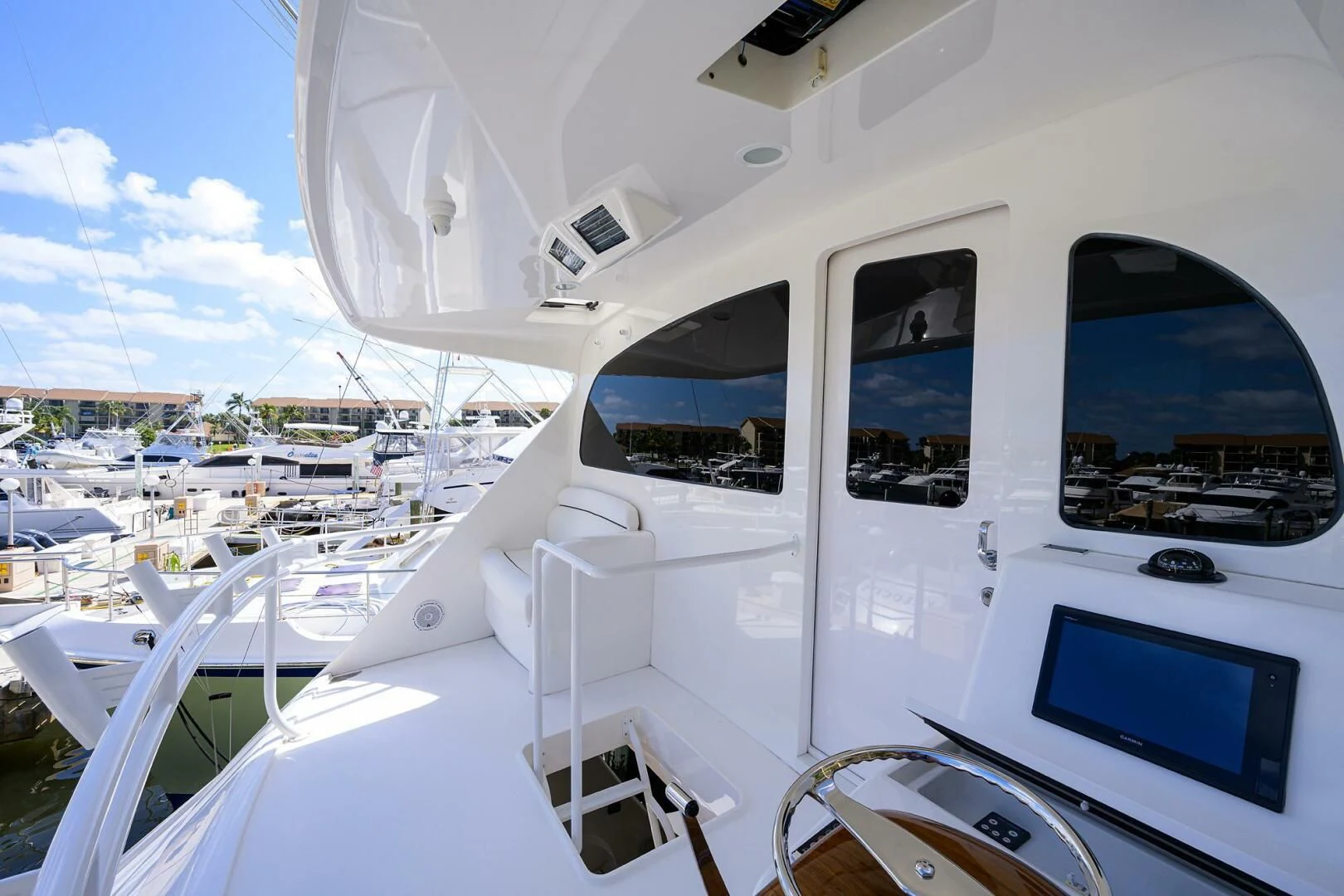 a white boat with a screen aboard 80' VIKING Yacht for Sale
