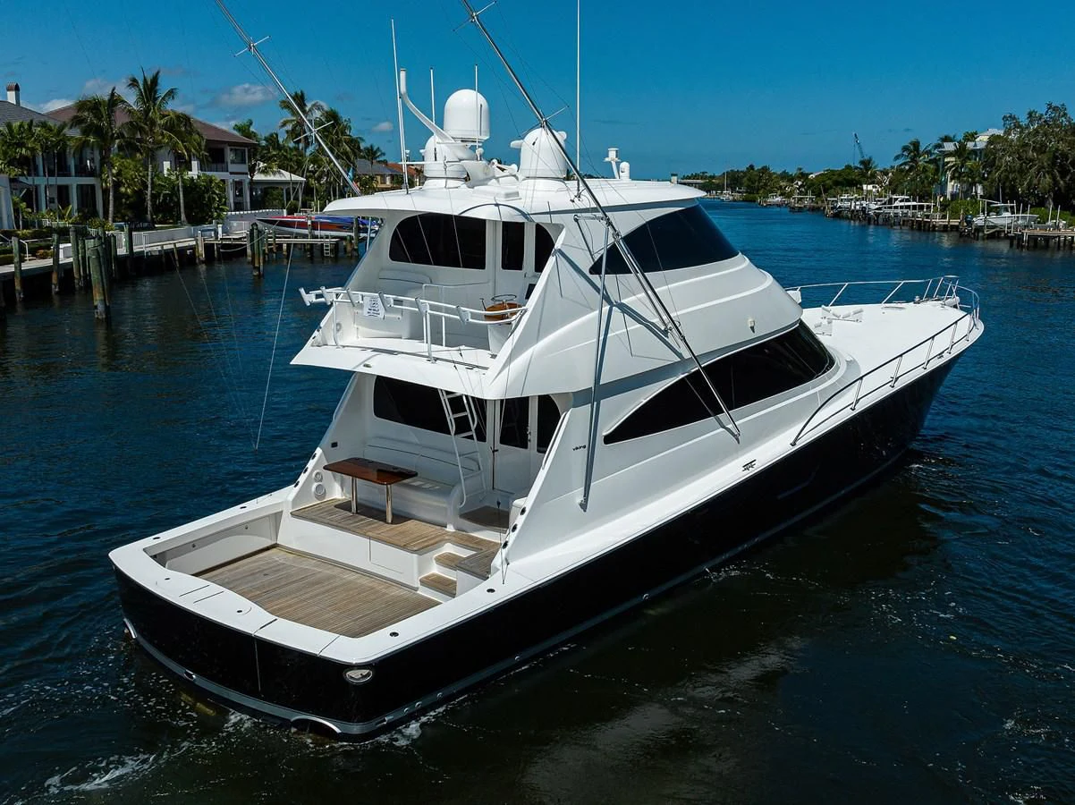 a white yacht in a harbor aboard 80' VIKING Yacht for Sale