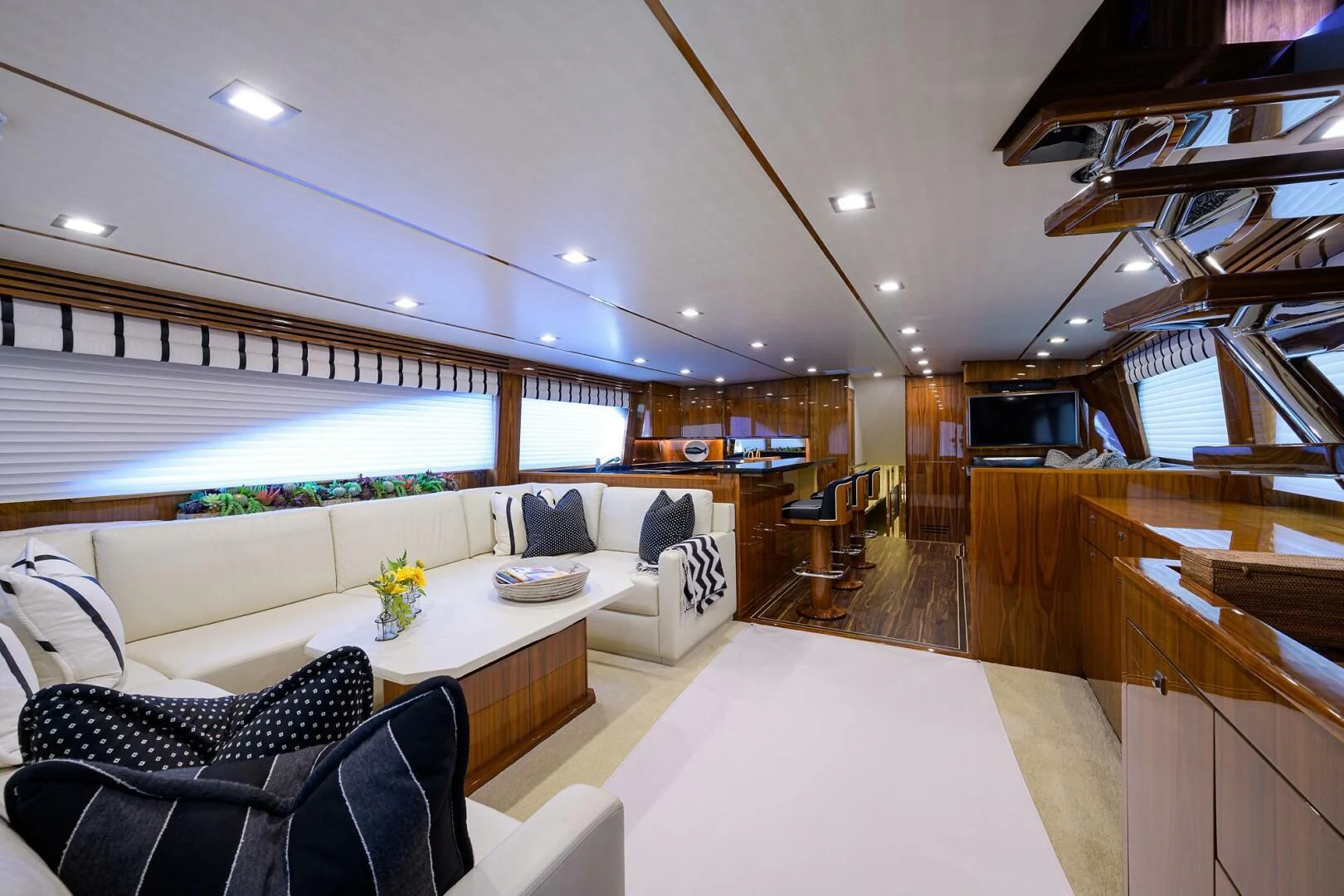 a living room with a large window aboard 80' VIKING Yacht for Sale