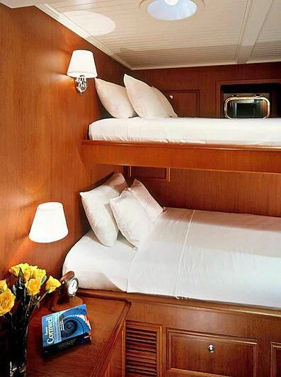 a hotel room with a bed aboard DOLPHIN Yacht for Sale