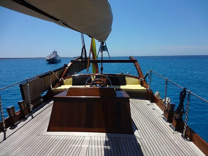 a boat on a deck aboard DOLPHIN Yacht for Sale