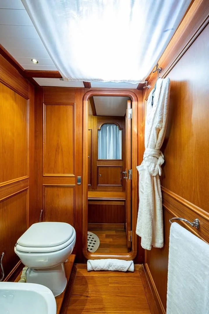 a bathroom with a toilet and a shower aboard ATALI Yacht for Sale