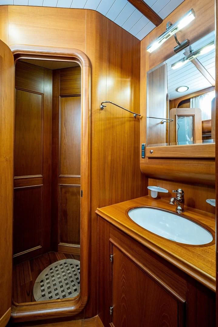 a bathroom with a sink and a mirror aboard ATALI Yacht for Sale