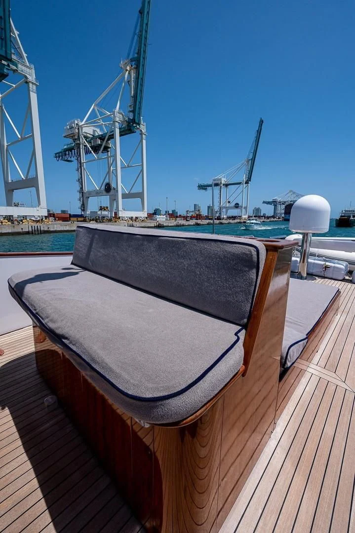 a deck with a large container on it and a large crane in the background aboard ATALI Yacht for Sale
