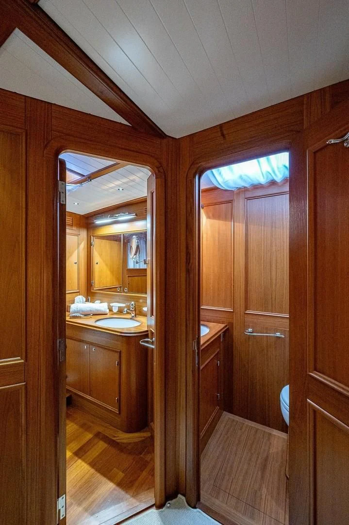 a bathroom with a sink and a mirror aboard ATALI Yacht for Sale
