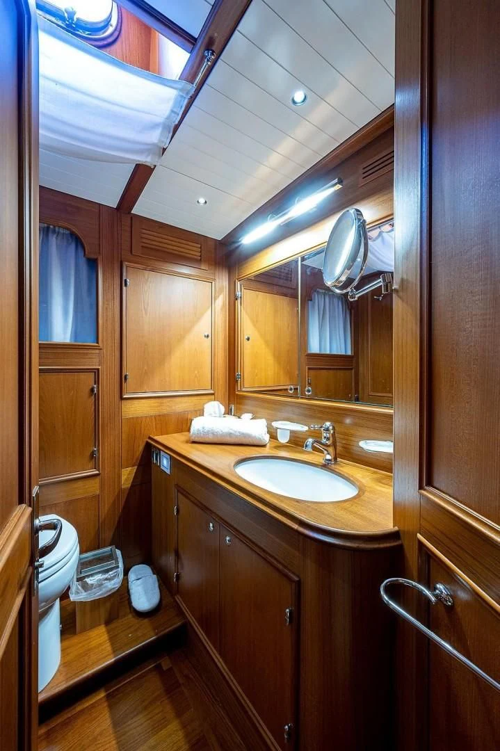 a bathroom with a sink and a mirror aboard ATALI Yacht for Sale
