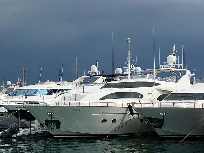 a couple of white yachts aboard HERO Yacht for Sale