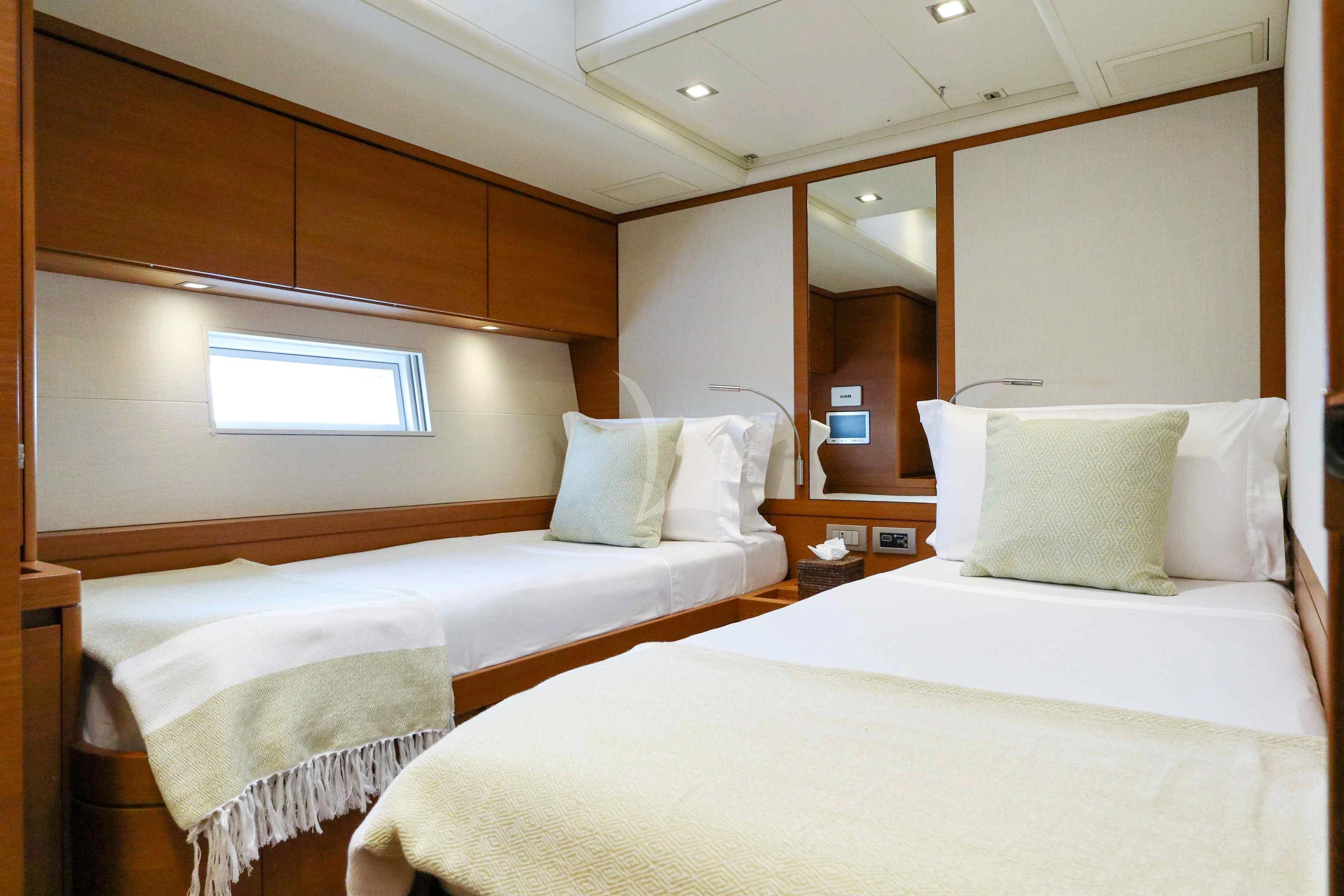 a room with two beds aboard FREEBIRD Yacht for Sale