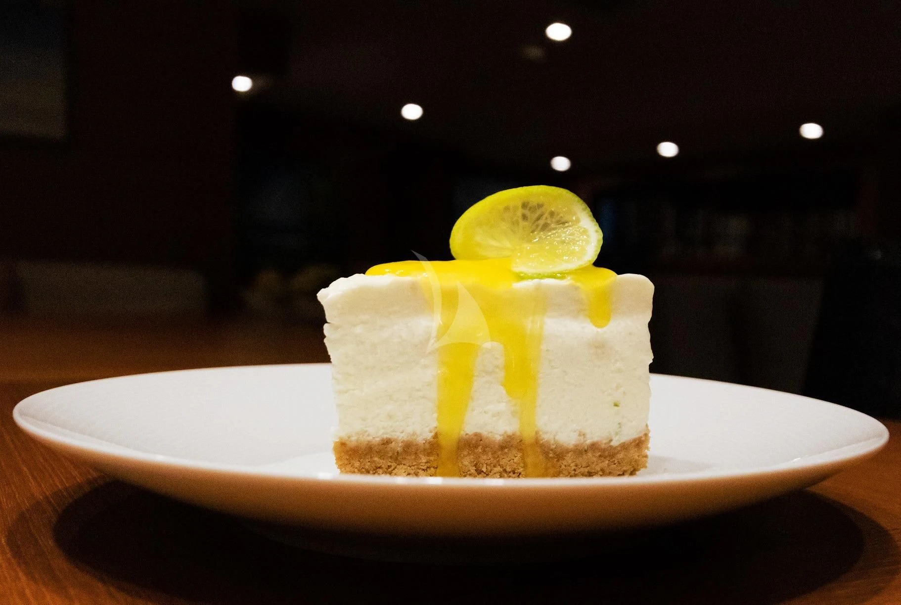 a slice of cake with a lemon on top aboard FREEBIRD Yacht for Sale