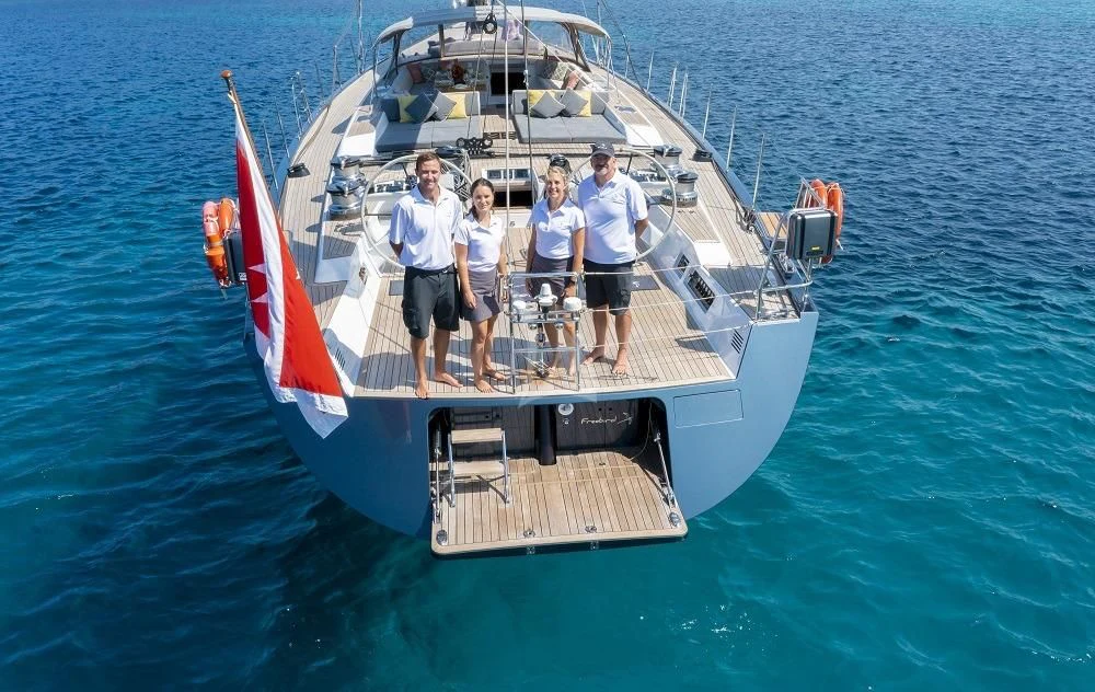 a group of people on a boat aboard FREEBIRD Yacht for Sale