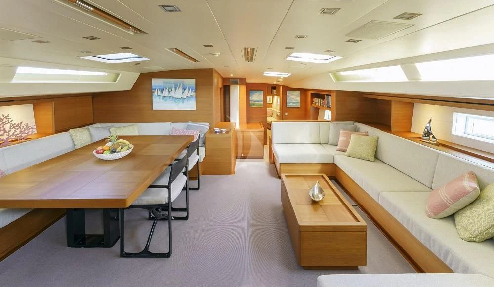 a room with a couch and a table aboard FREEBIRD Yacht for Sale