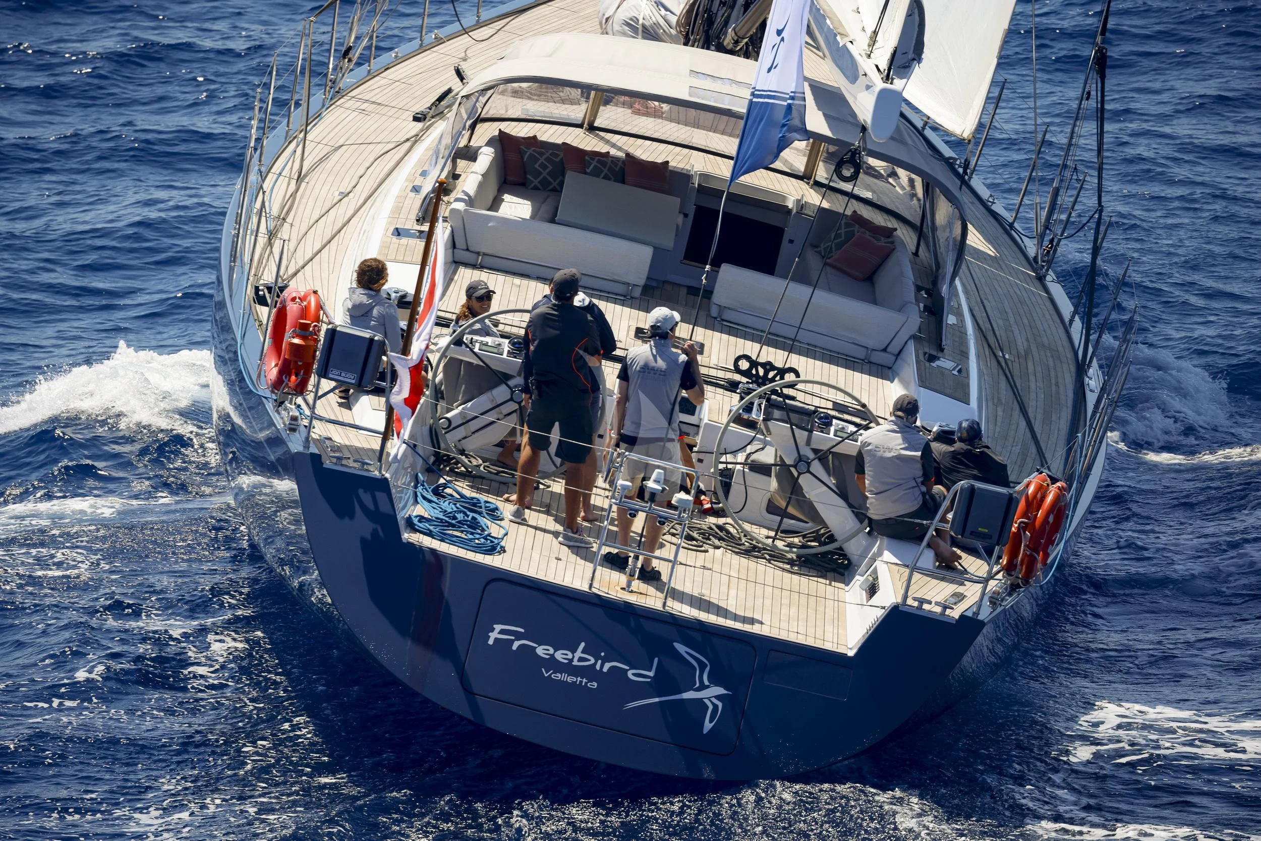 a group of people on a boat aboard FREEBIRD Yacht for Sale