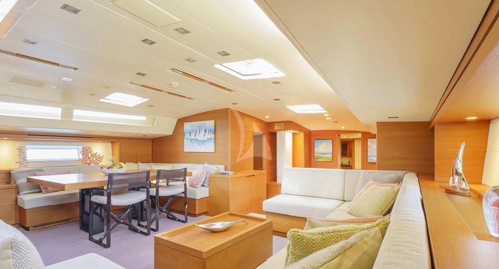 a room with a couch and a table aboard FREEBIRD Yacht for Sale