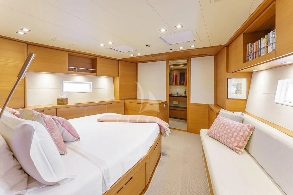 a room with two beds aboard FREEBIRD Yacht for Sale