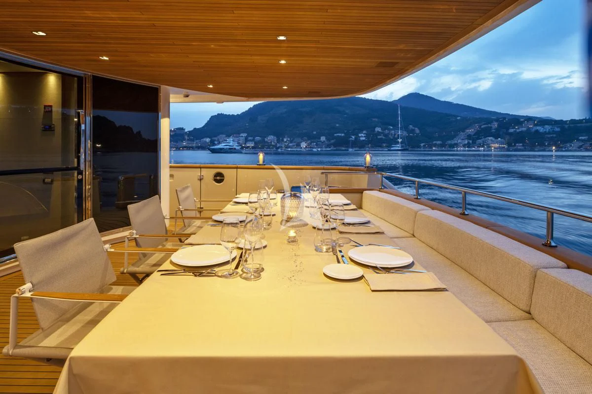a table set for a dinner on a boat aboard ANYTHING GOES V Yacht for Sale