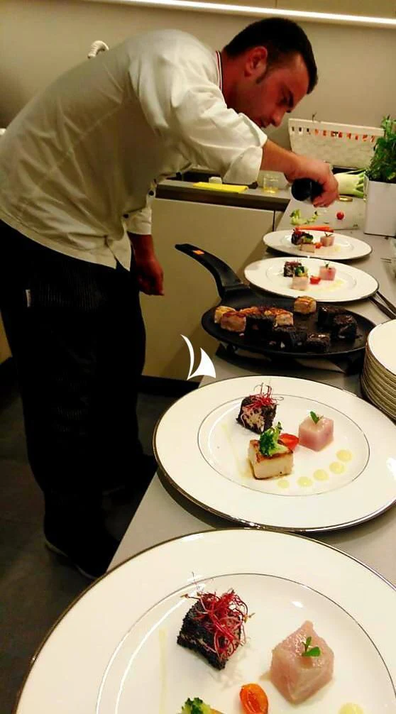 a person pouring a liquid into a glass aboard ANYTHING GOES V Yacht for Sale