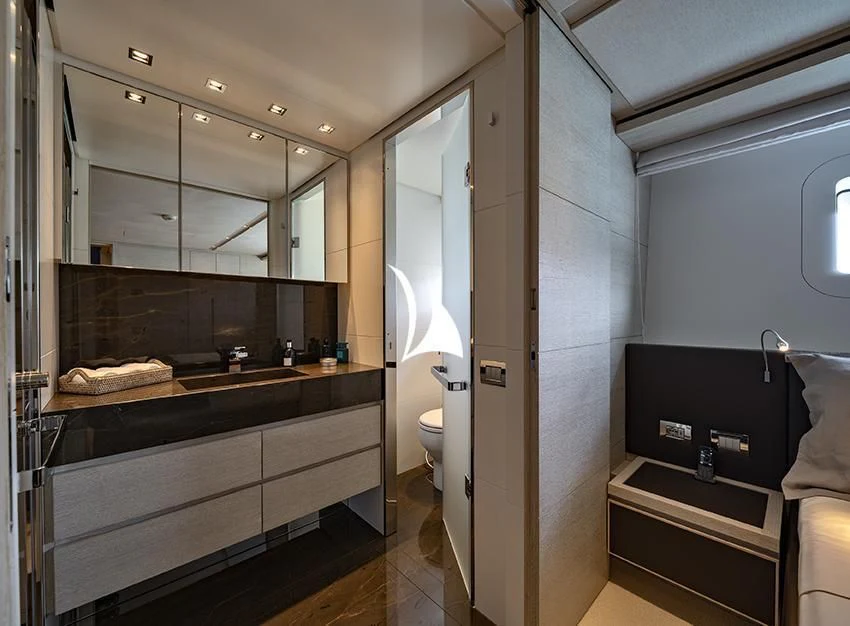 a bathroom with a large mirror aboard ANYTHING GOES V Yacht for Sale