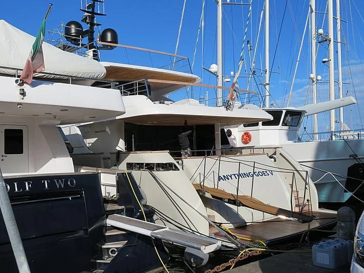 a boat docked at a pier aboard ANYTHING GOES V Yacht for Sale