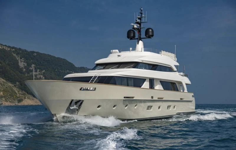 a white yacht on the water aboard ANYTHING GOES V Yacht for Sale