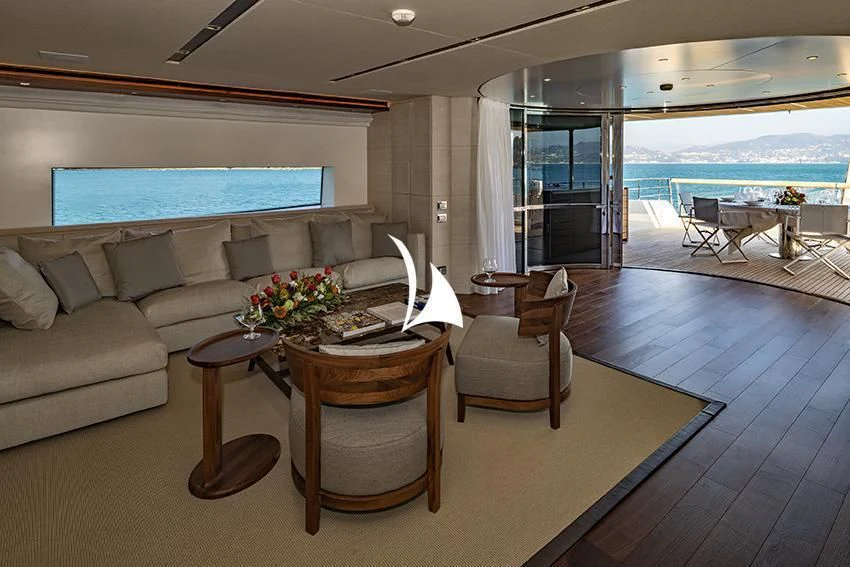 a living room with a table and chairs aboard ANYTHING GOES V Yacht for Sale