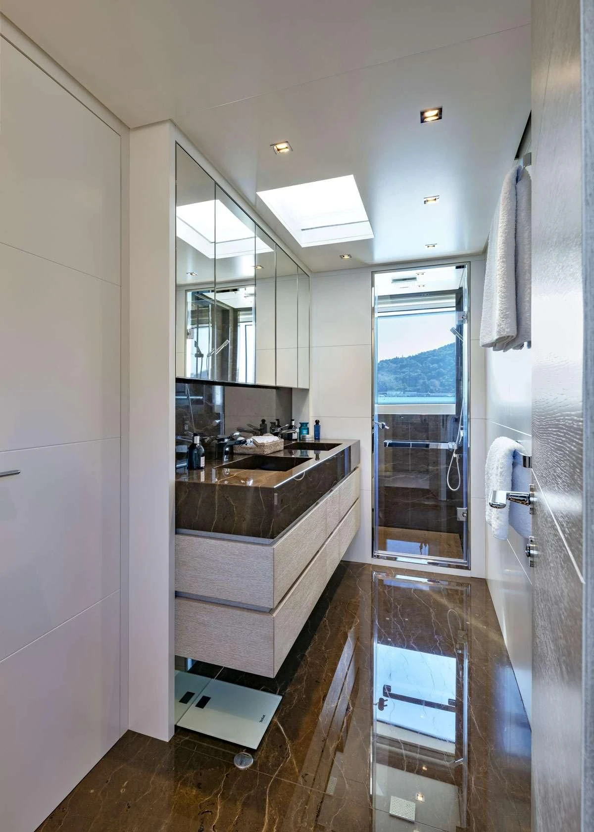 a bathroom with a sink and a shower unit aboard ANYTHING GOES V Yacht for Sale