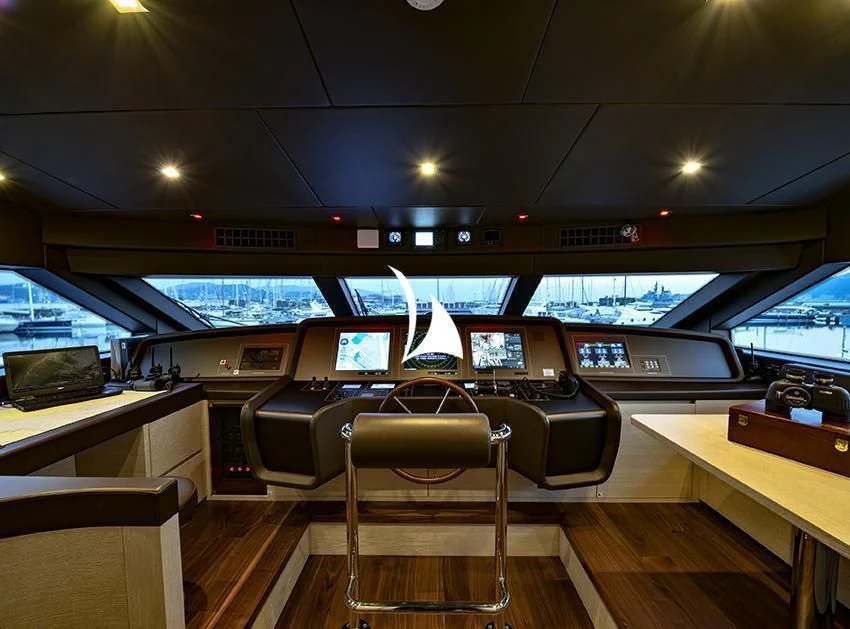 a room with a desk and chairs aboard ANYTHING GOES V Yacht for Sale
