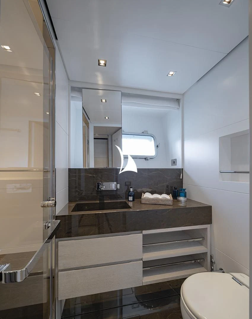 a bathroom with a glass shower aboard ANYTHING GOES V Yacht for Sale