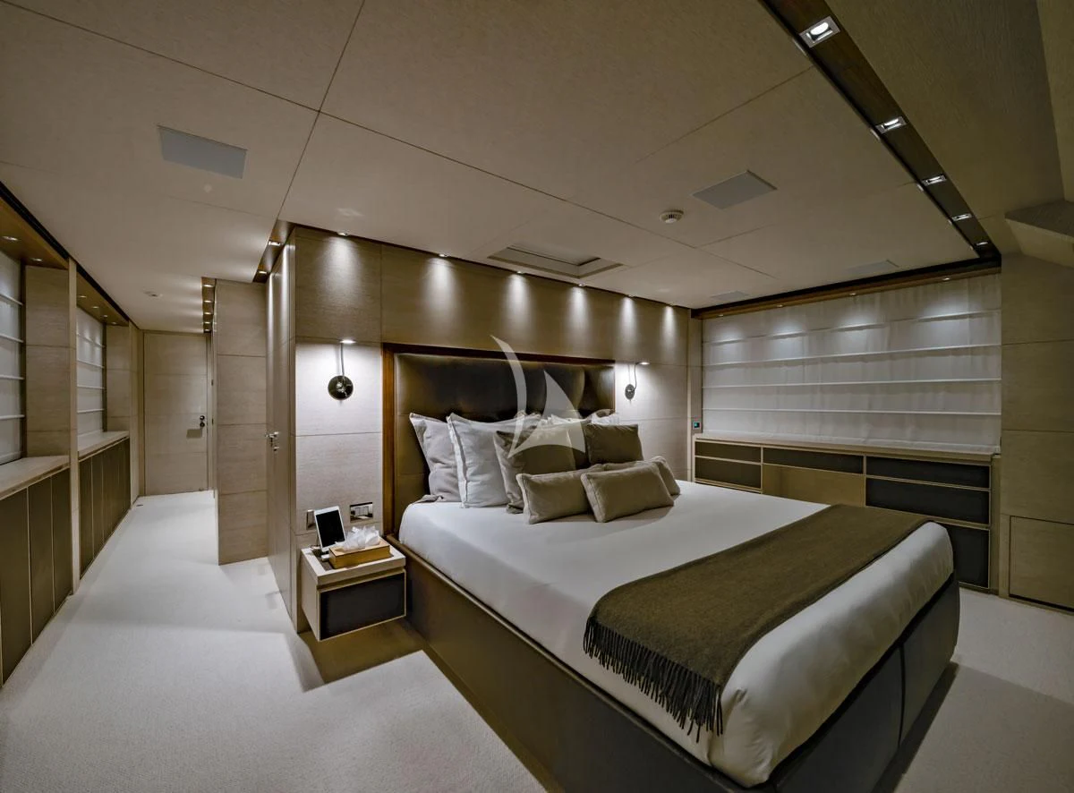 a room with a bed and a desk aboard ANYTHING GOES V Yacht for Sale