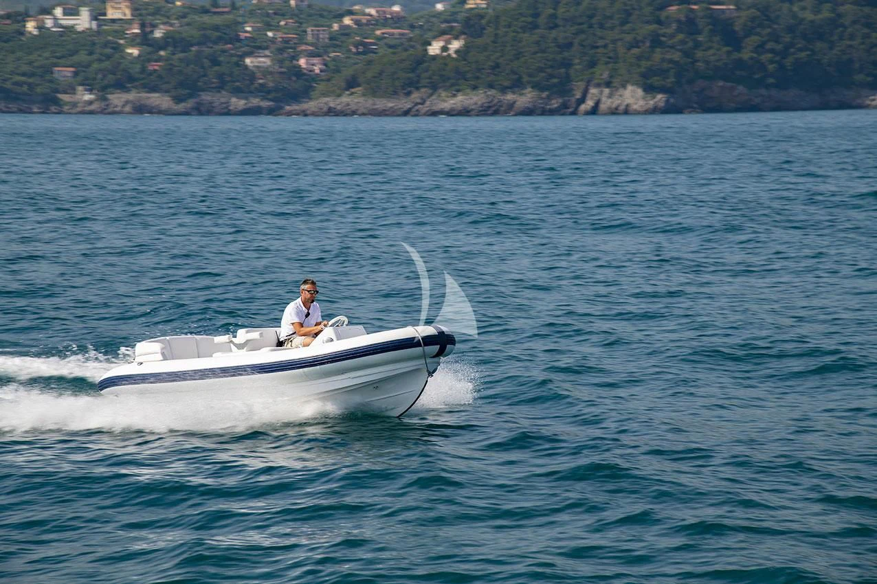 a person in a white boat aboard ANYTHING GOES V Yacht for Sale