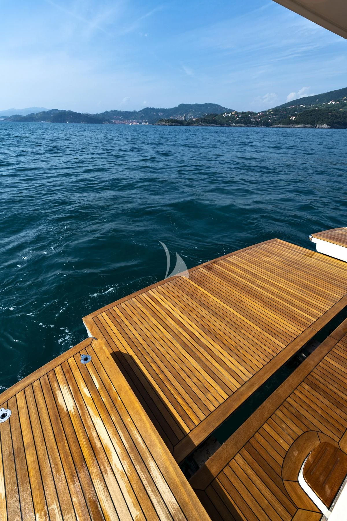 a deck overlooking a body of water aboard ANYTHING GOES V Yacht for Sale