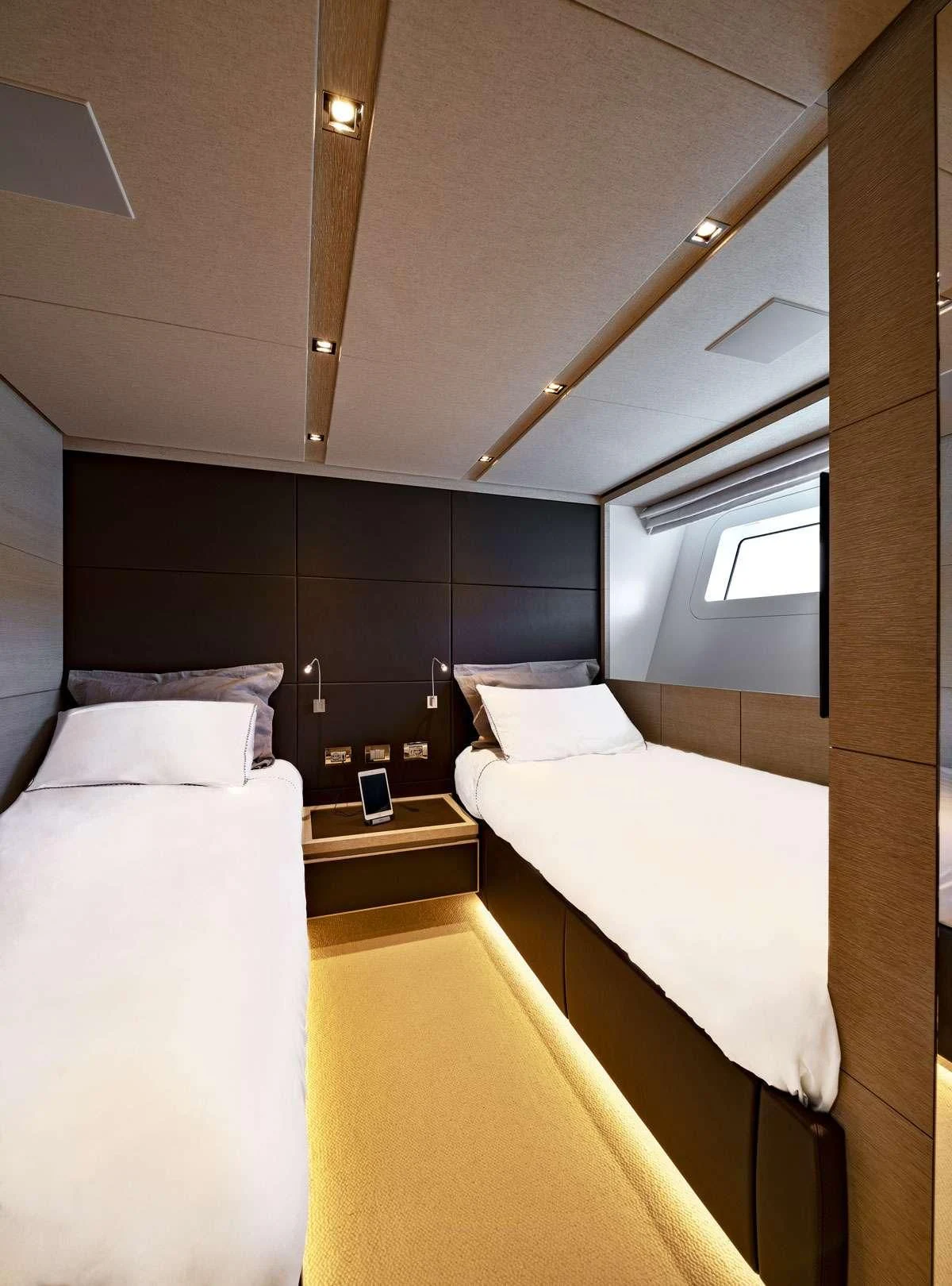 a room with a bed and a window aboard ANYTHING GOES V Yacht for Sale