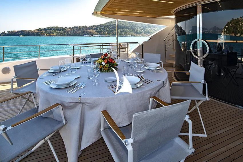 a table set for a meal on a boat aboard ANYTHING GOES V Yacht for Sale
