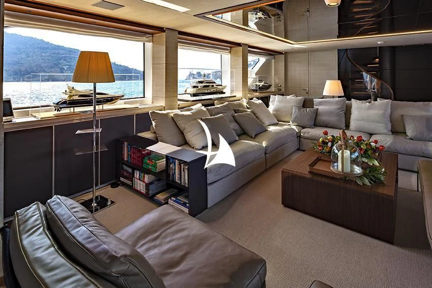 a living room with a couch and a coffee table aboard ANYTHING GOES V Yacht for Sale