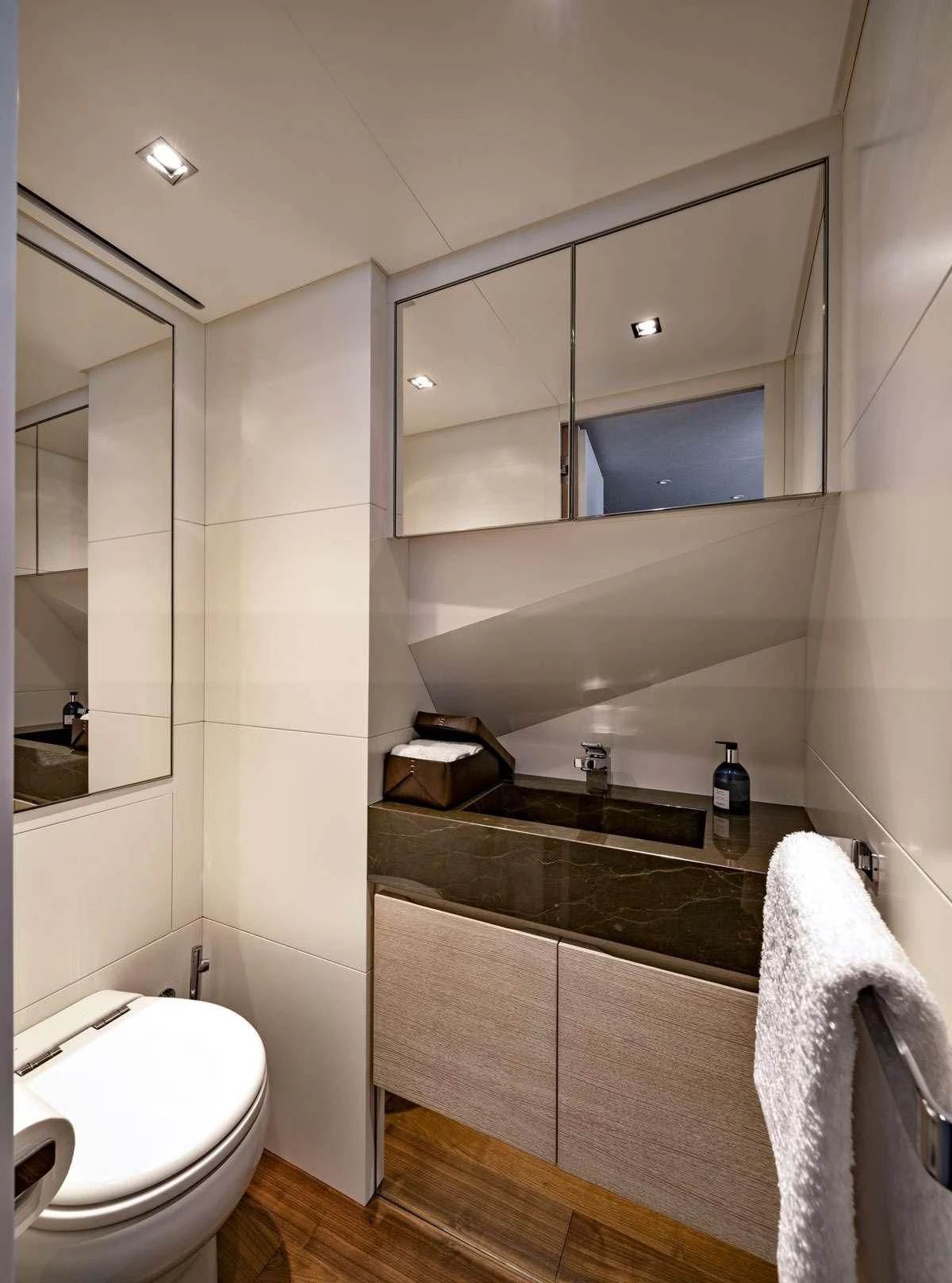 a bathroom with a large mirror aboard ANYTHING GOES V Yacht for Sale