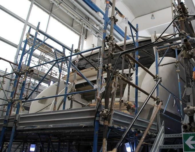 a large room with pipes and wires aboard ANYTHING GOES V Yacht for Sale