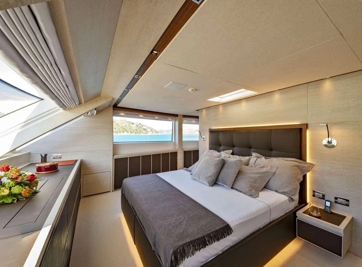a bed in a room aboard ANYTHING GOES V Yacht for Sale