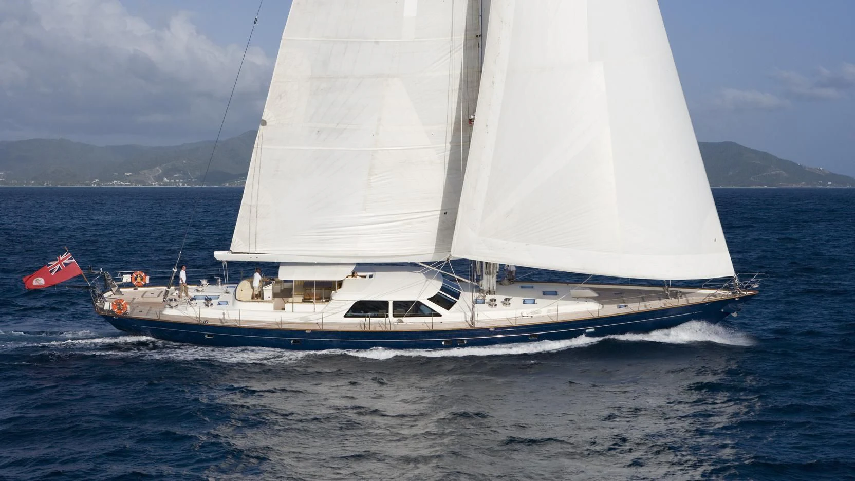 a white sailboat on the water aboard NAKUPENDA Yacht for Sale