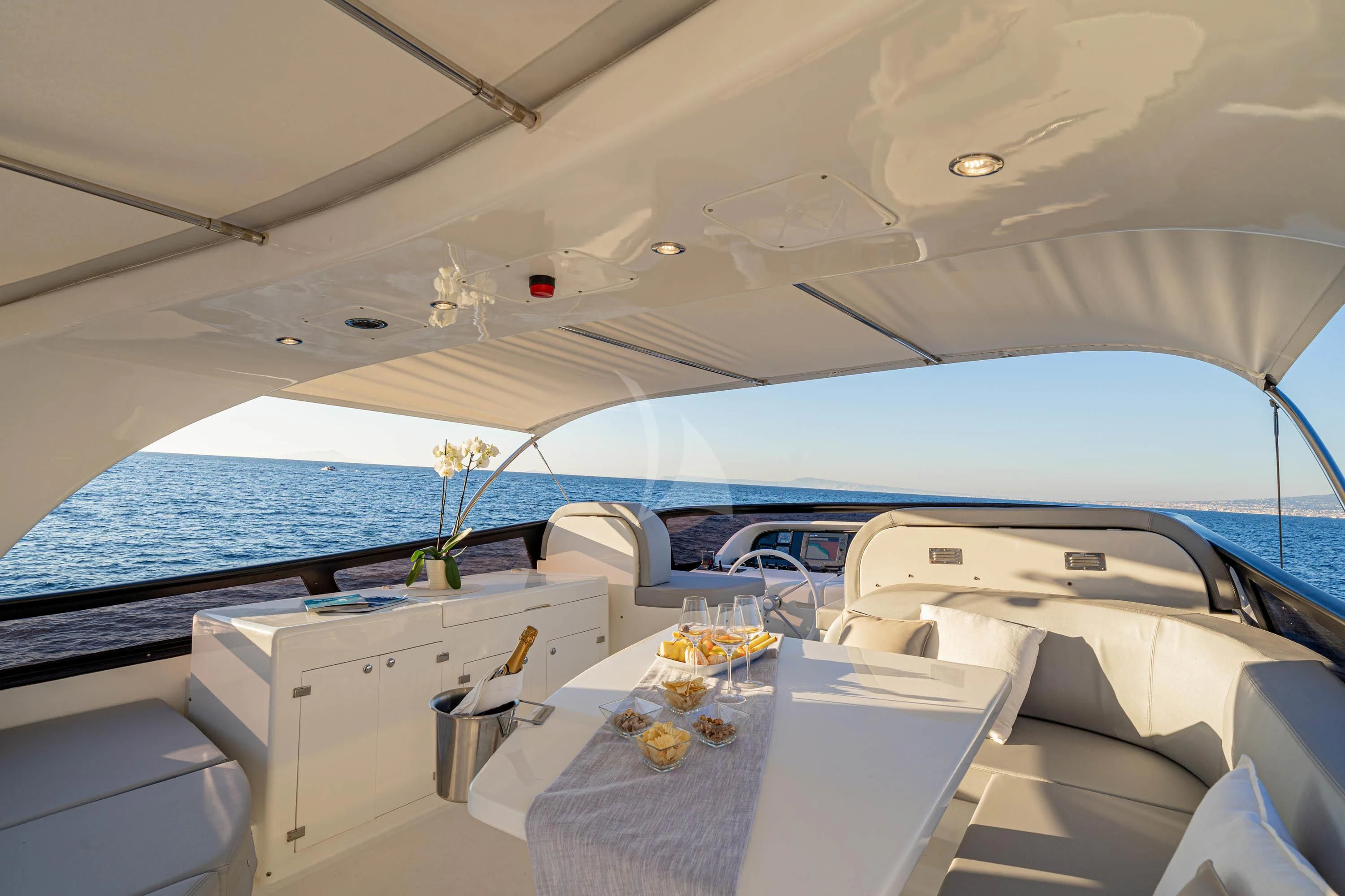 a boat with a table and chairs aboard GEMINI 3 Yacht for Charter