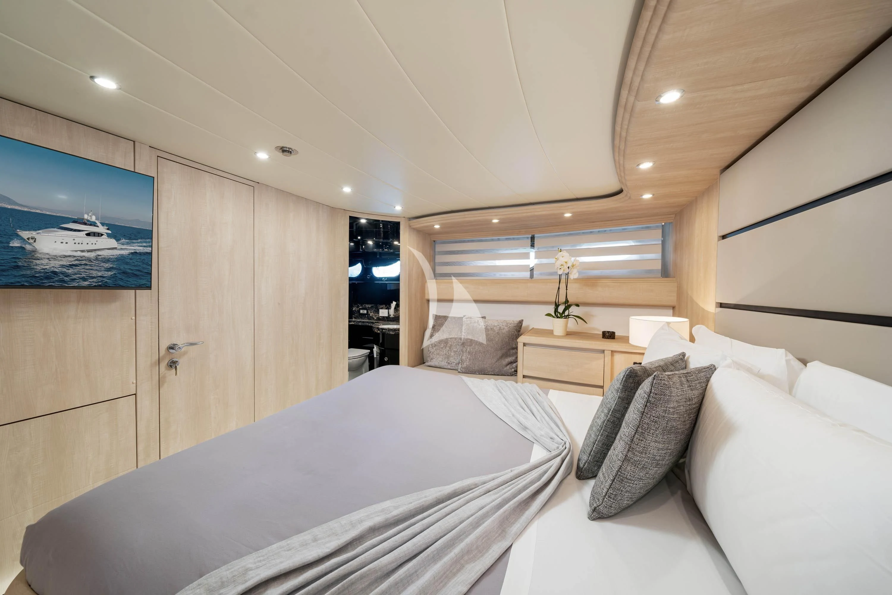 a room with a bed and a mirror aboard GEMINI 3 Yacht for Charter
