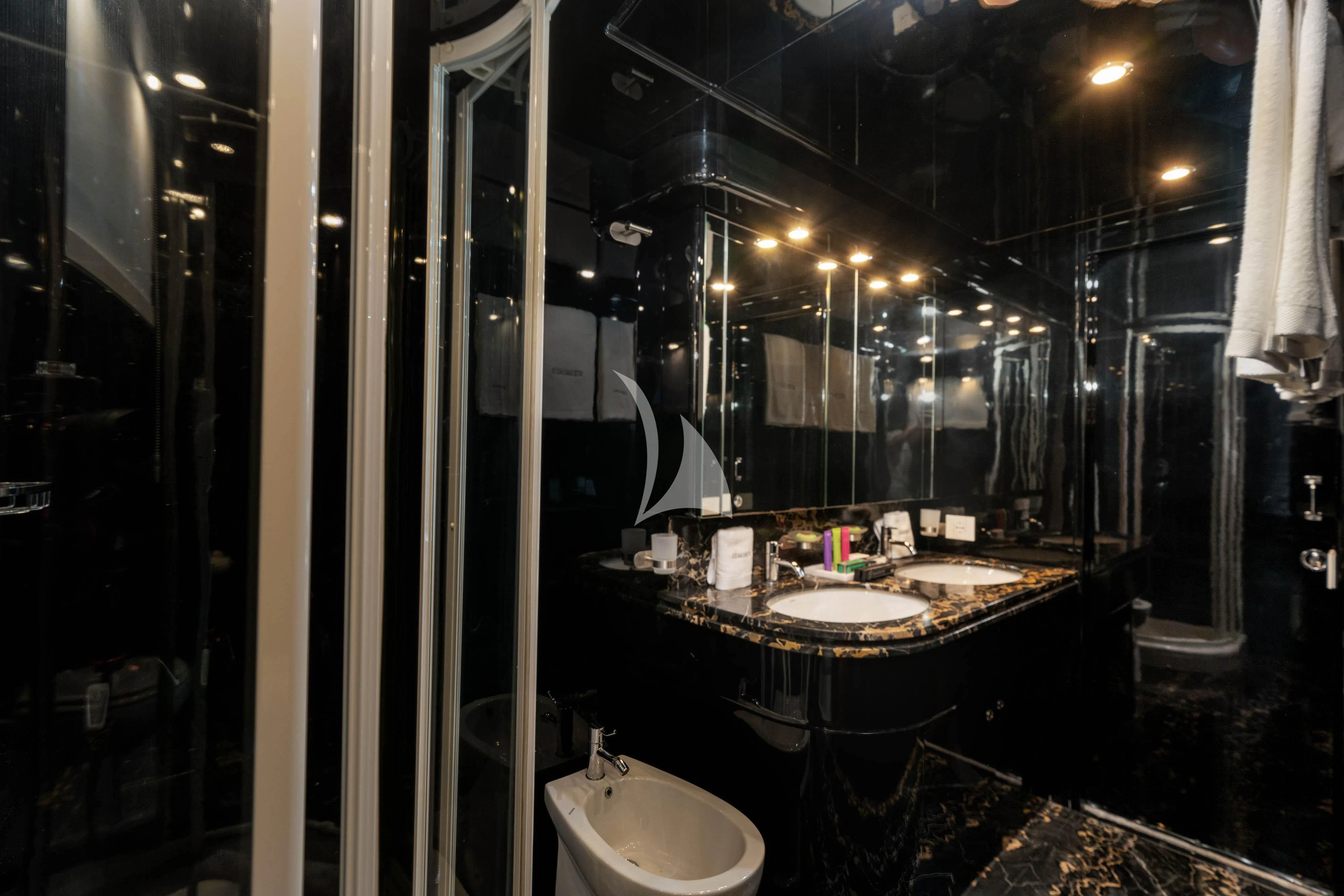 a bathroom with a sink and a mirror aboard GEMINI 3 Yacht for Charter