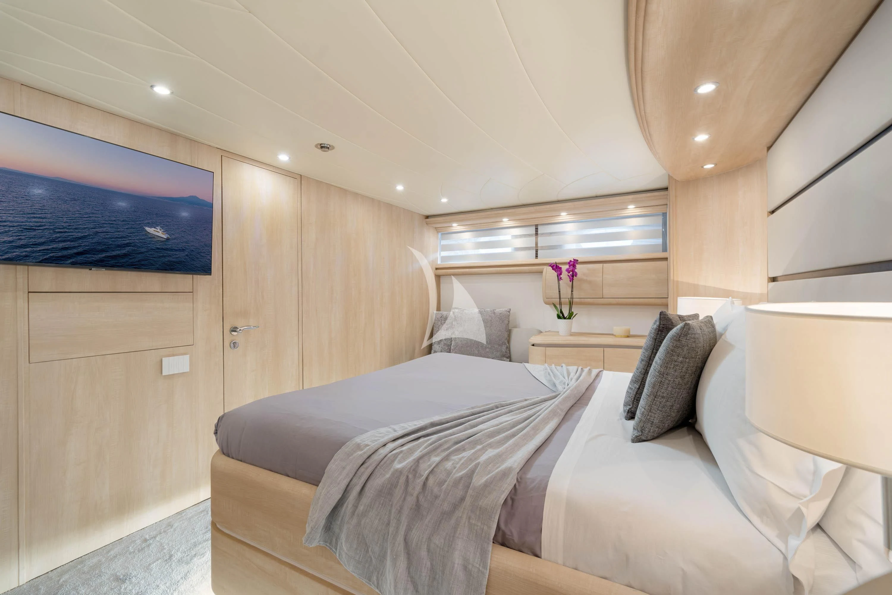 a room with a bed and a desk aboard GEMINI 3 Yacht for Charter