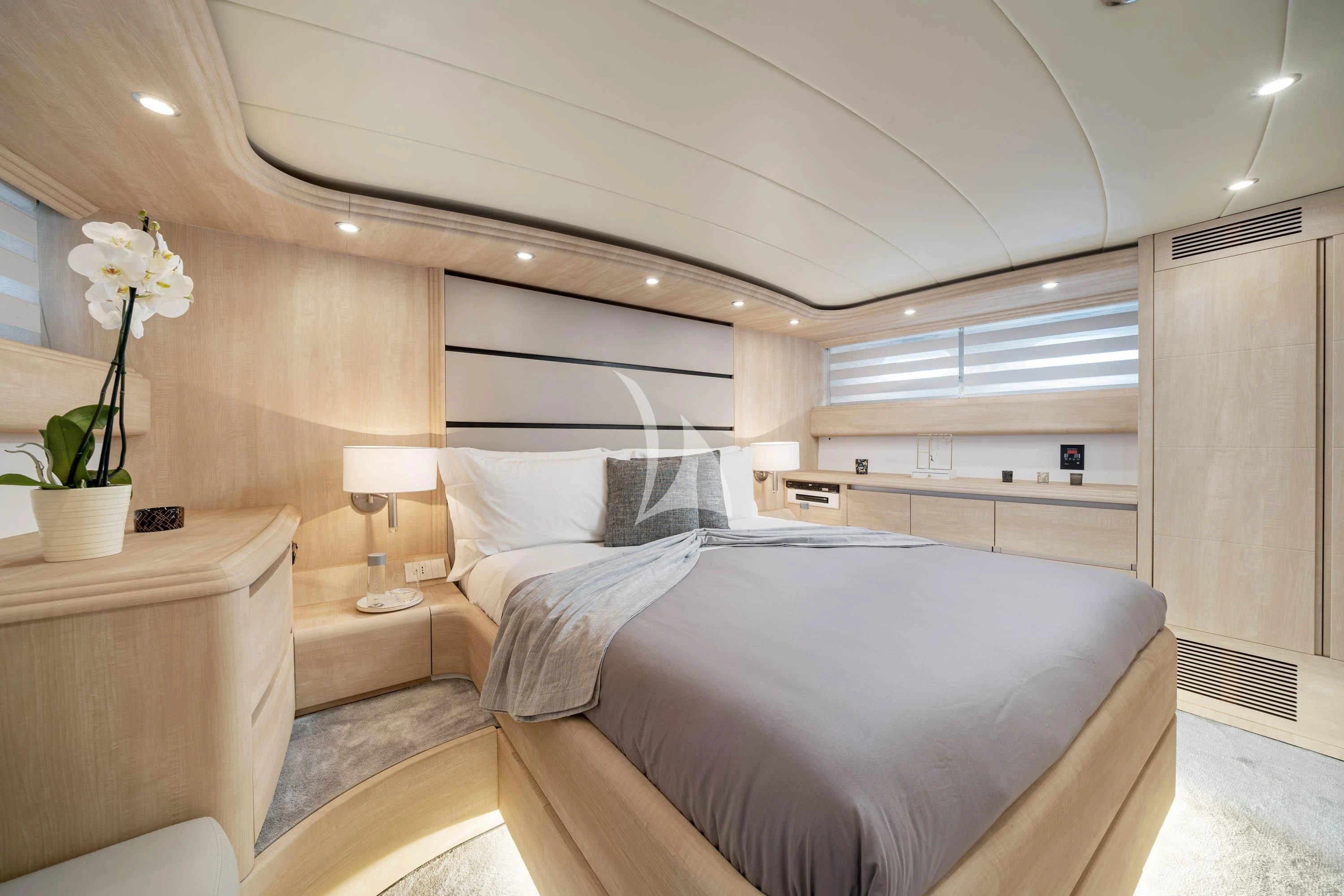 a bedroom with a bed and a desk aboard GEMINI 3 Yacht for Charter