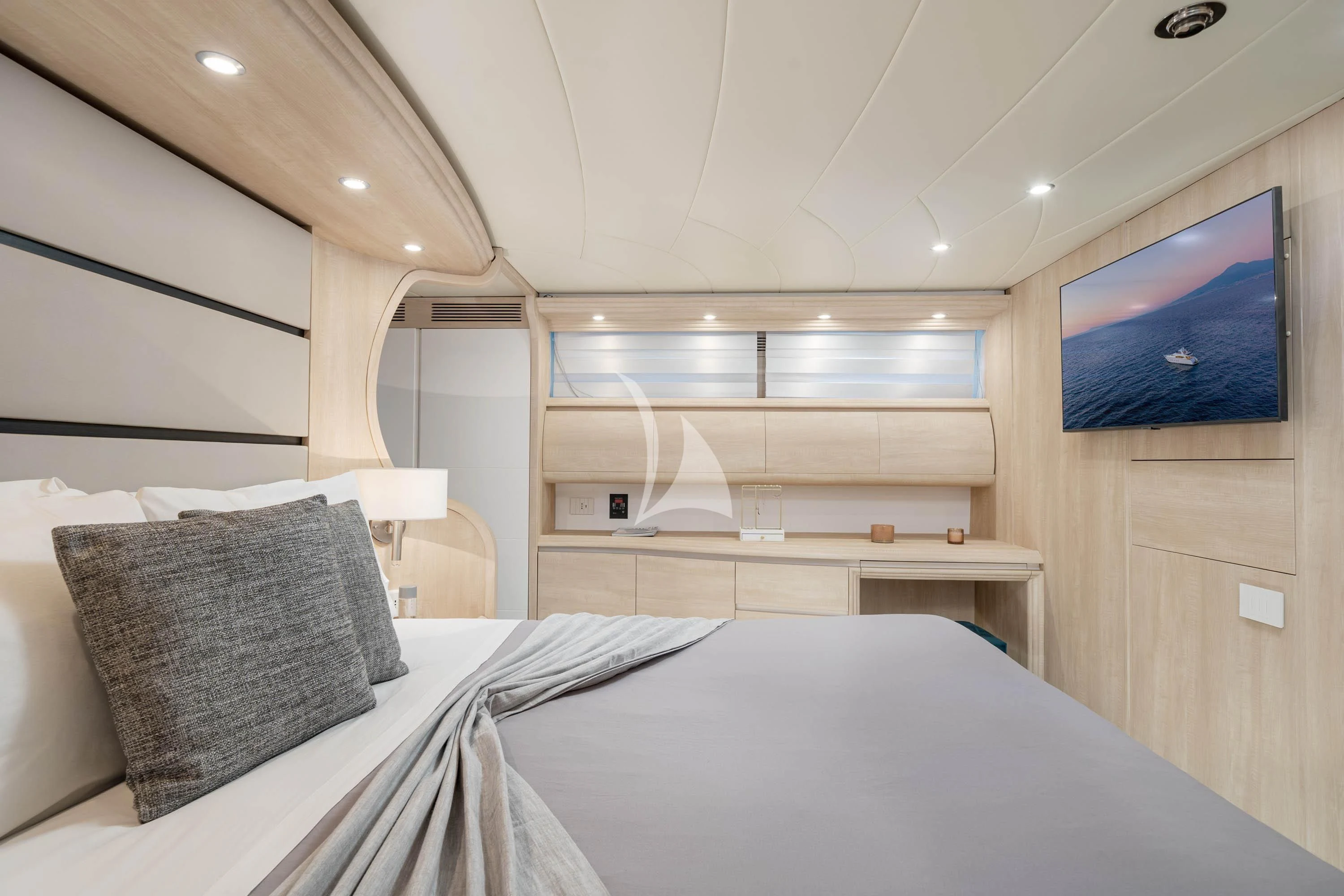 a room with a bed and a television aboard GEMINI 3 Yacht for Charter