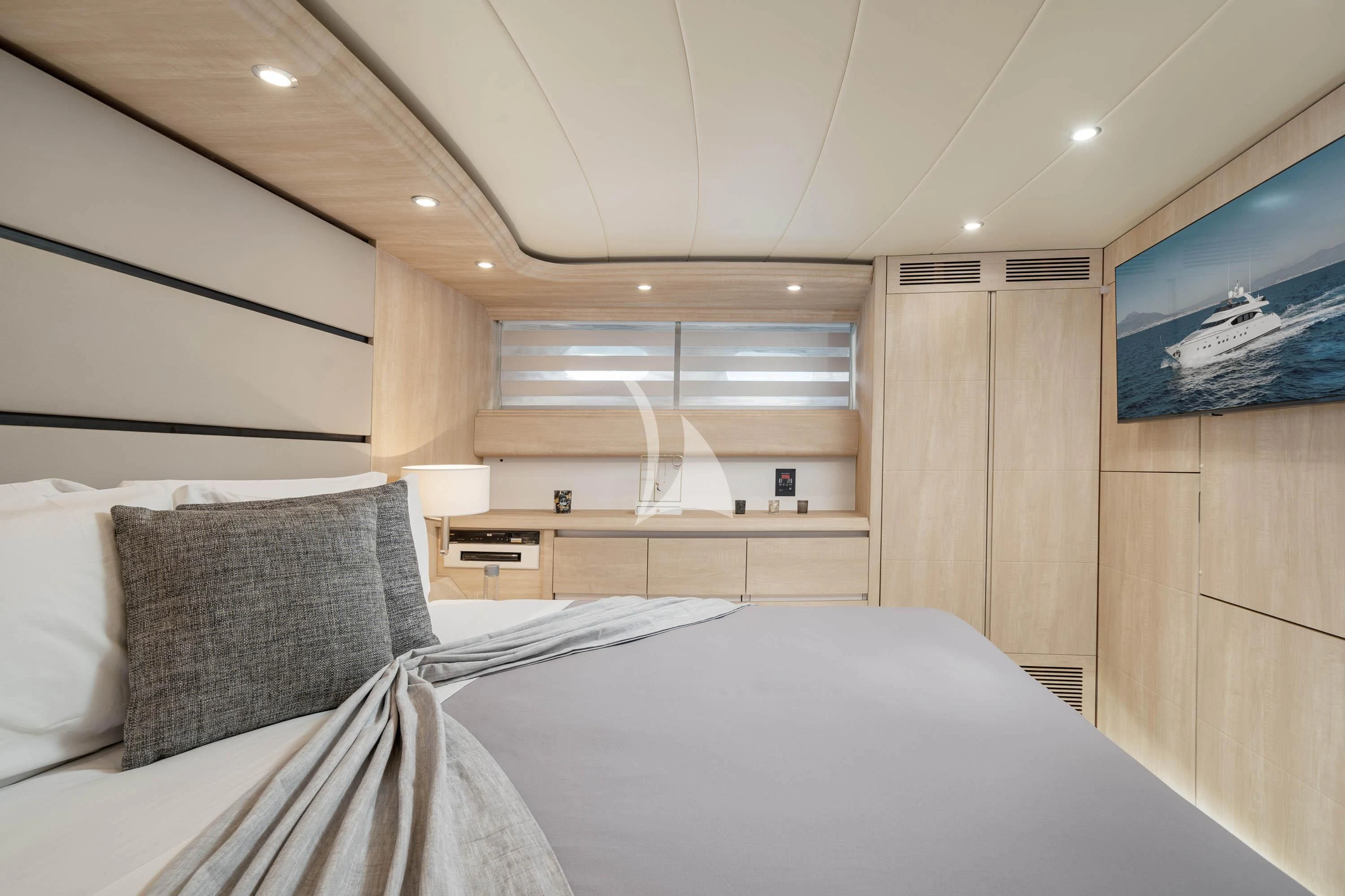a bedroom with a bed and a tv aboard GEMINI 3 Yacht for Charter