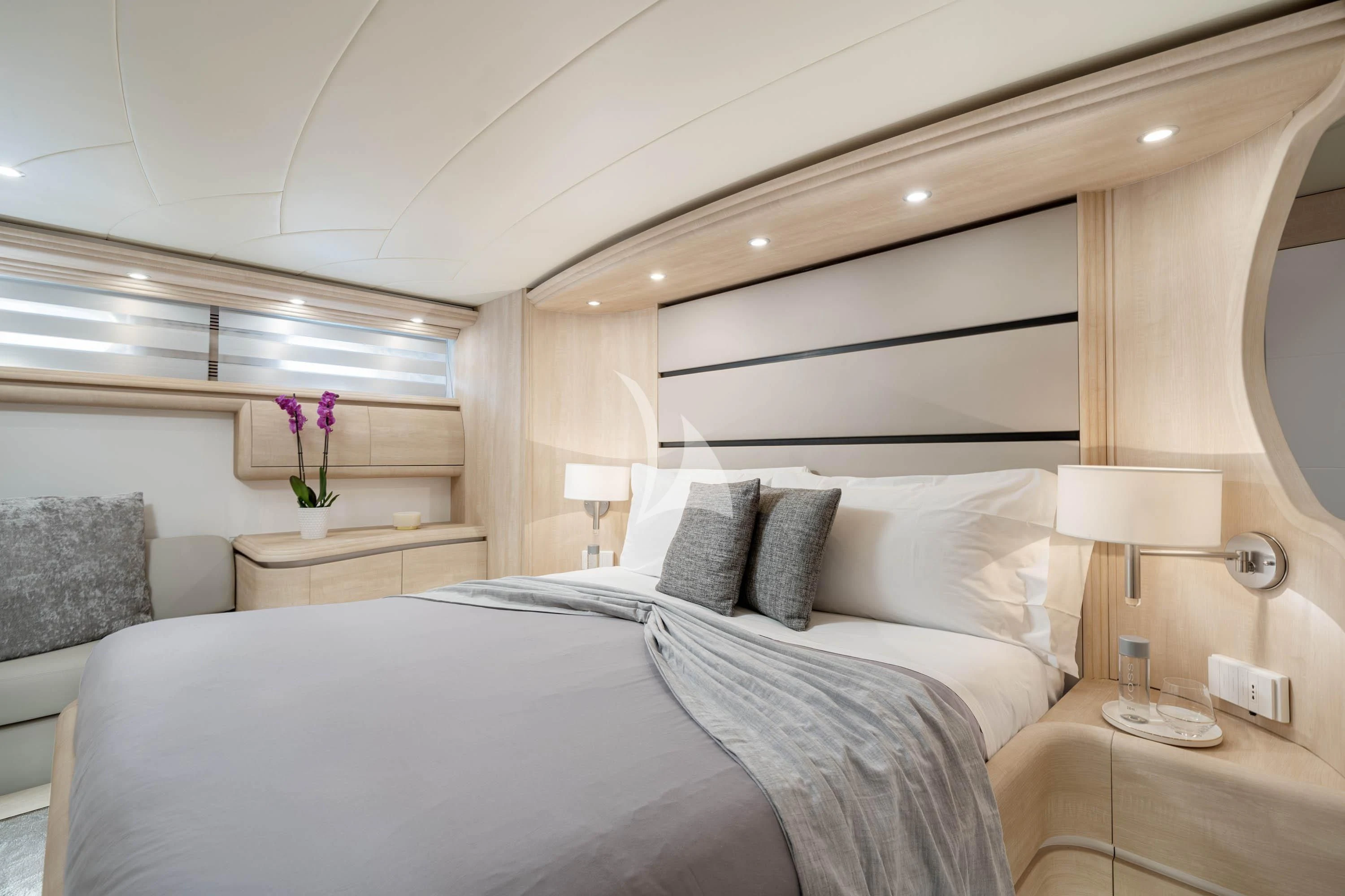 a bed with white sheets and pillows aboard GEMINI 3 Yacht for Charter