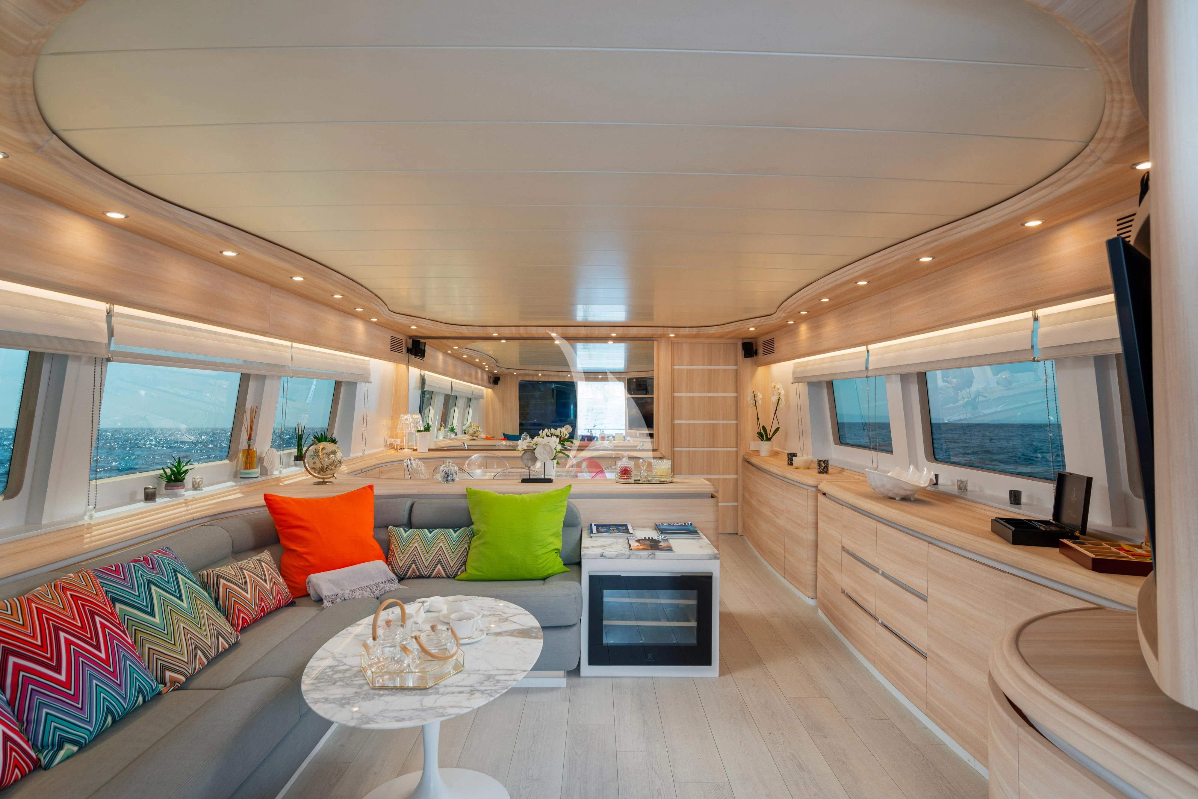 a living room with a large window aboard GEMINI 3 Yacht for Charter