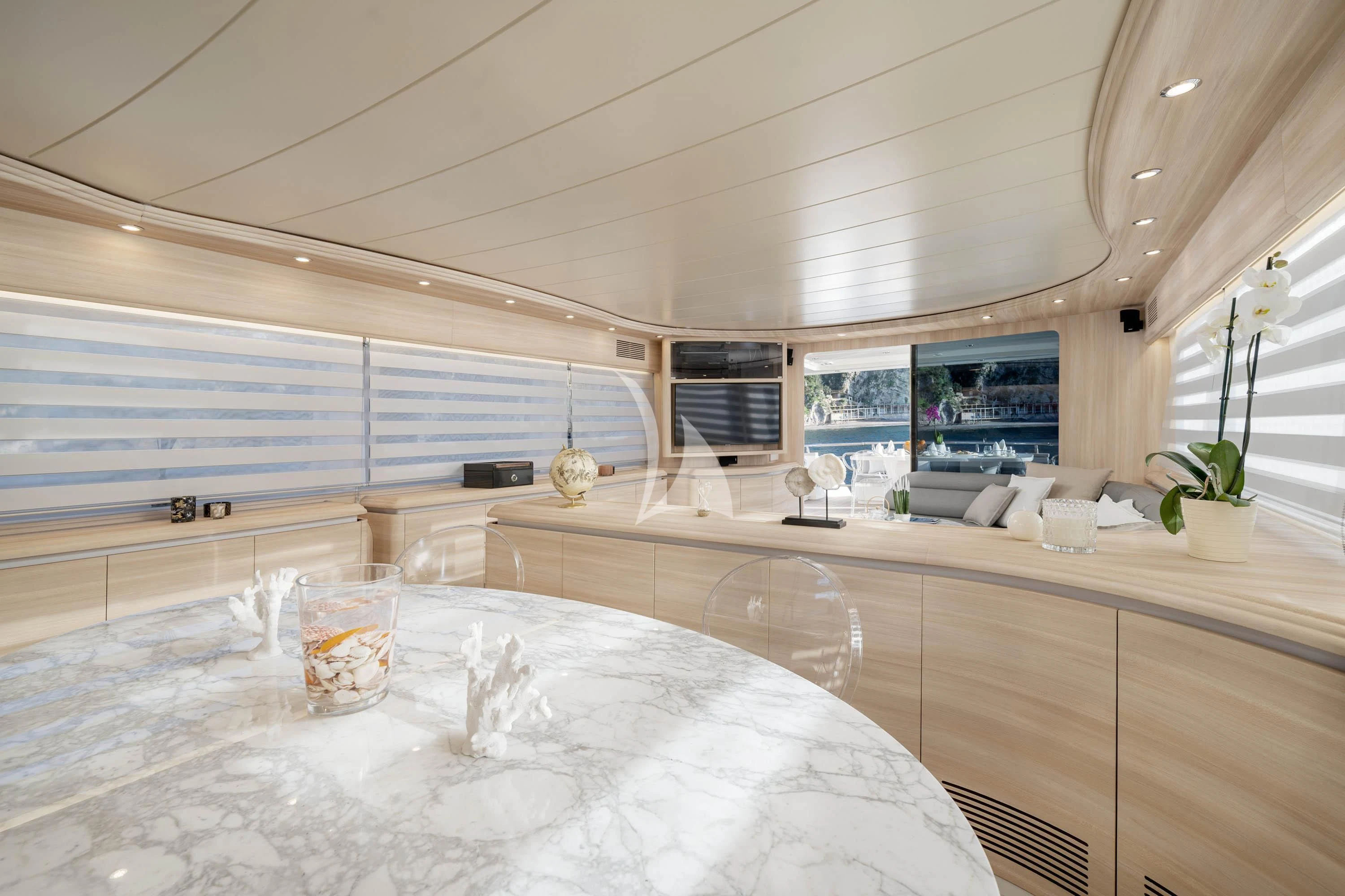 a large kitchen with a large white table and chairs aboard GEMINI 3 Yacht for Charter