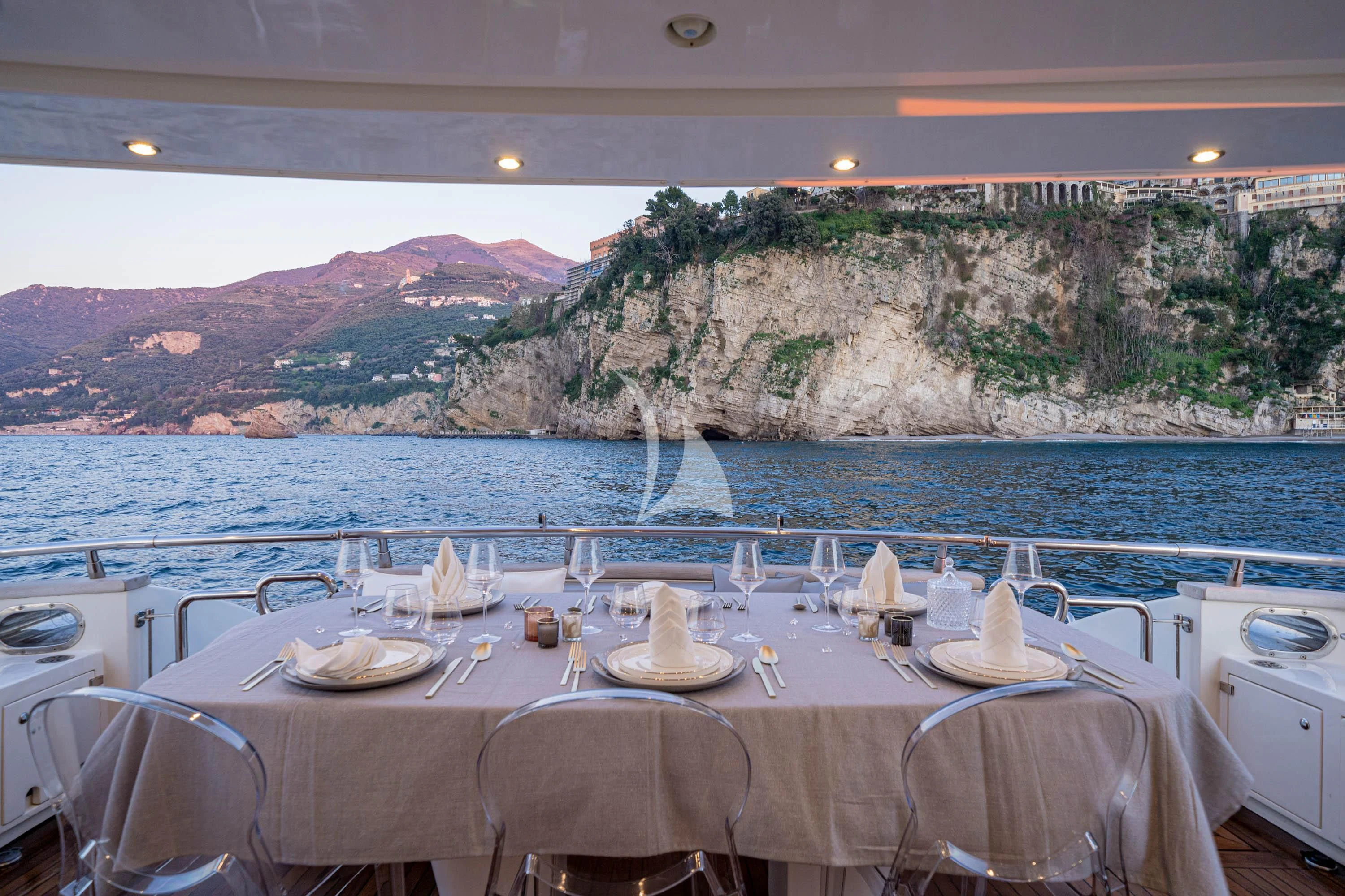 a table with plates and glasses on it aboard GEMINI 3 Yacht for Charter