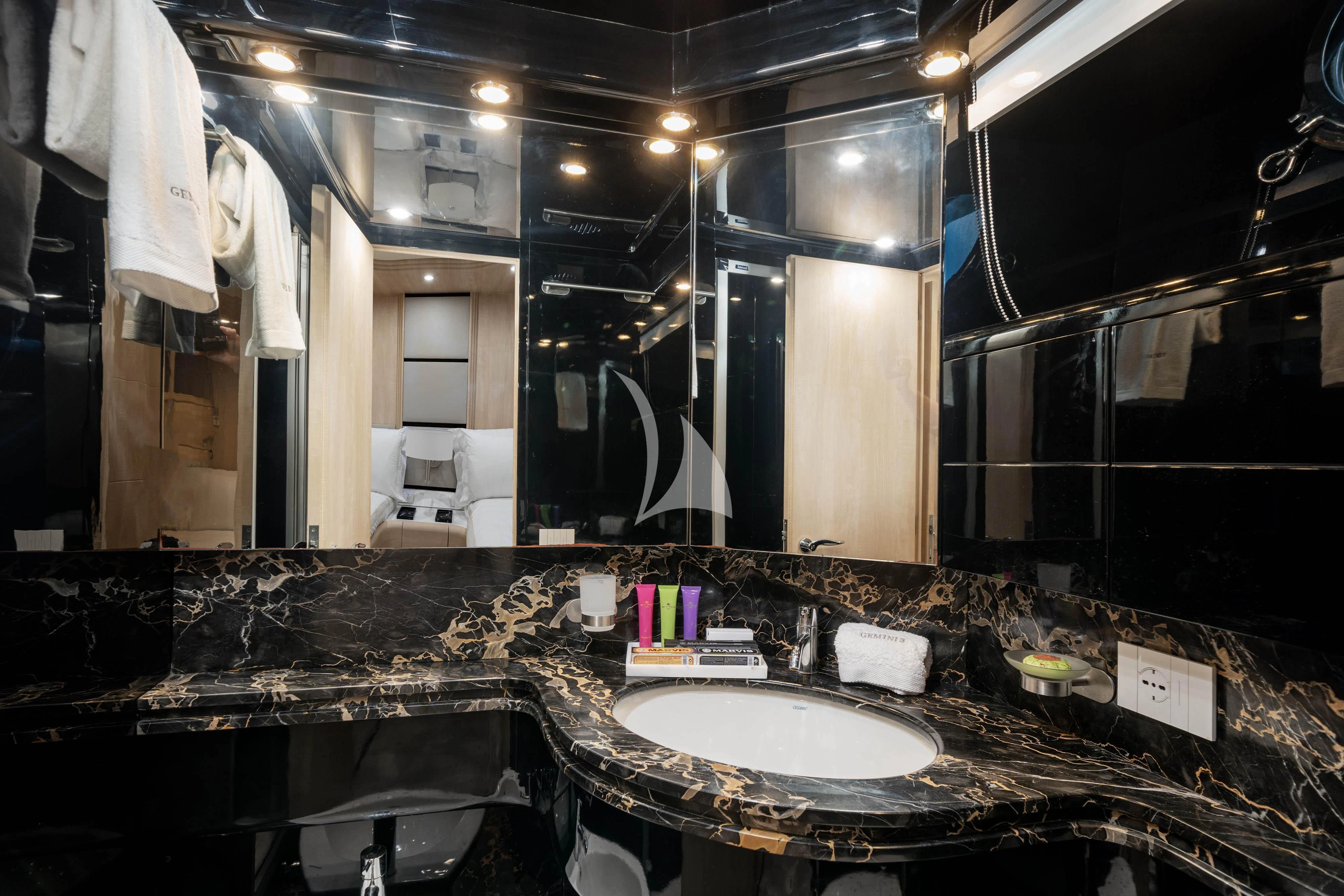 a bathroom with a large mirror aboard GEMINI 3 Yacht for Charter